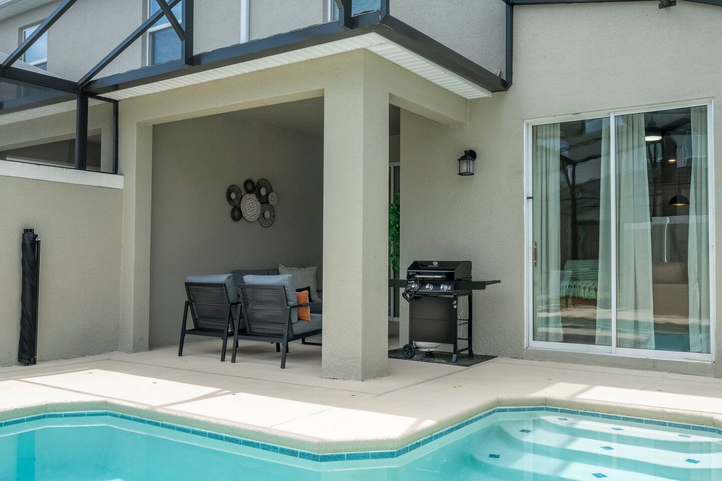 This is a cozy living area with modern furnishings to enjoy moments by the pool