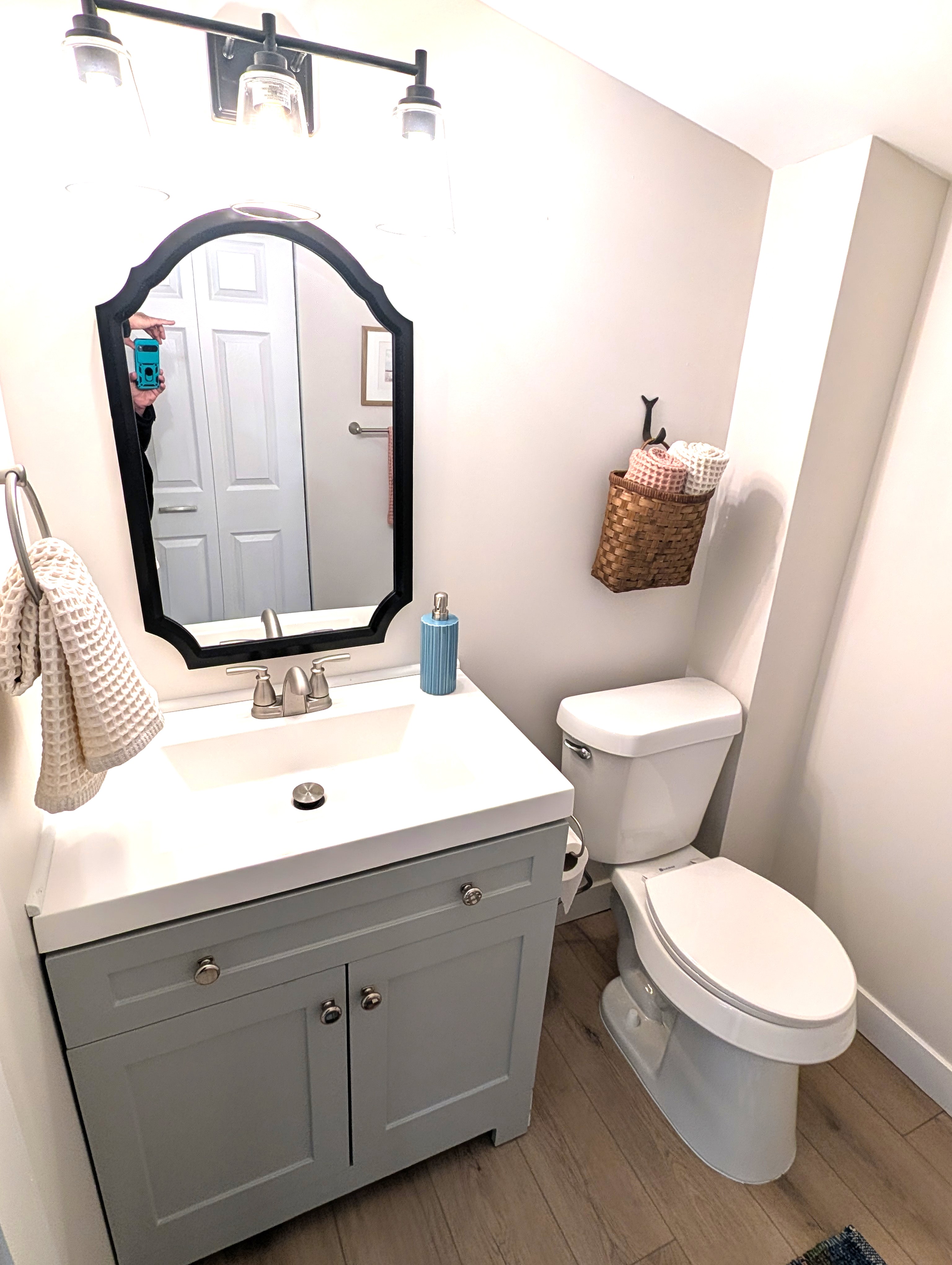 BATHROOM #2 (MAIN FLOOR):  This is a very convenient half-bathroom off of the kitchen.  It also includes a laundry closet with a stacked washer and dryer in it.