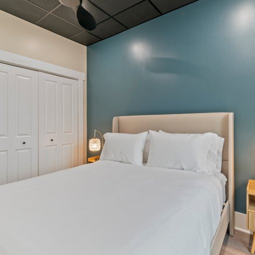 Bedroom 3 – Queen Bed, Ample Storage & Soft Lighting