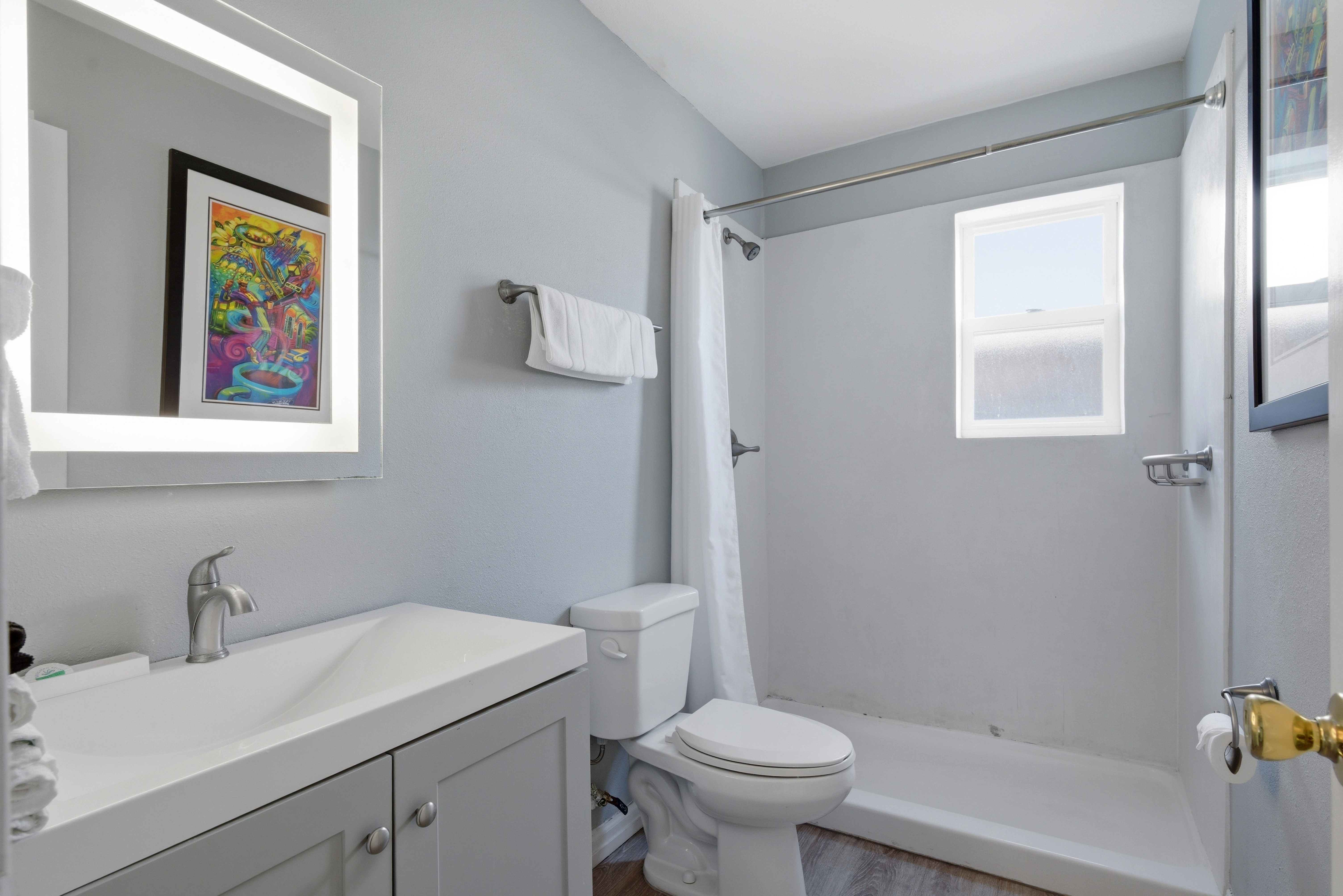 Fresh bathroom space stocked with essentials to refresh & unwind