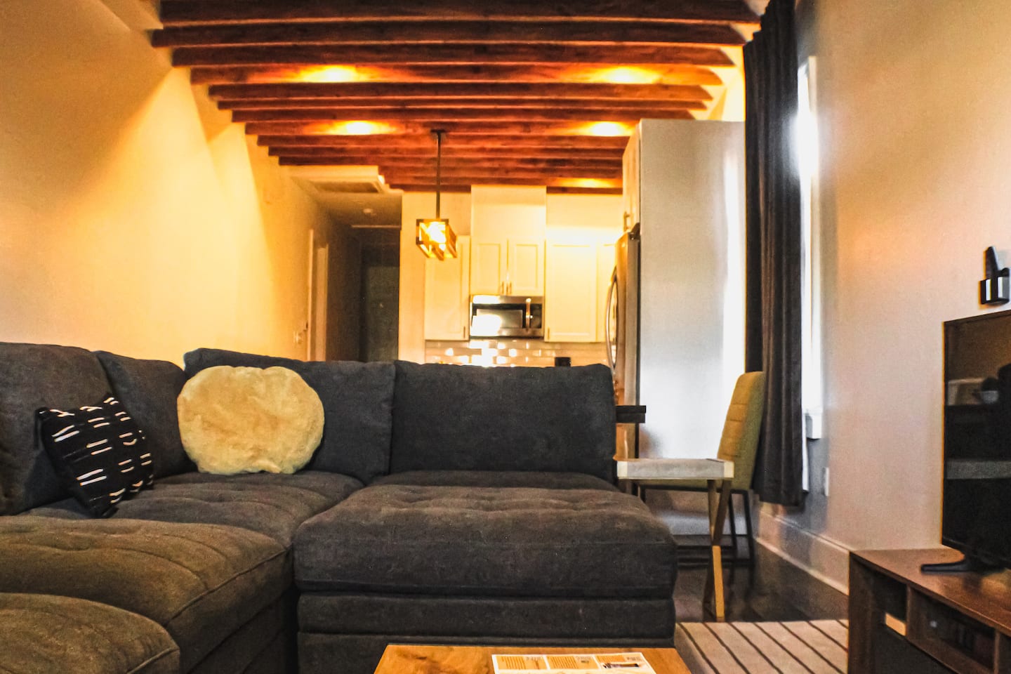 Exposed beams and comfy seating—classic NOLA charm meets modern comfort.