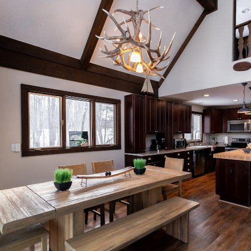 Gather around the spacious dining table and enjoy meals prepared in the fully equipped kitchen—ideal for large groups!