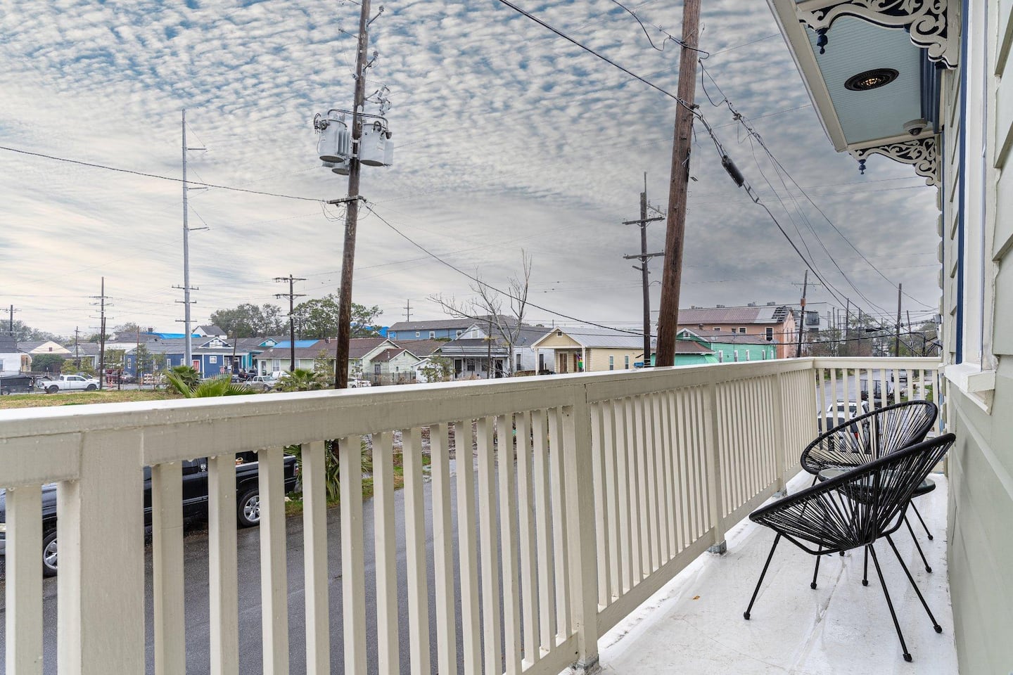 Private balcony with two chairs and small table