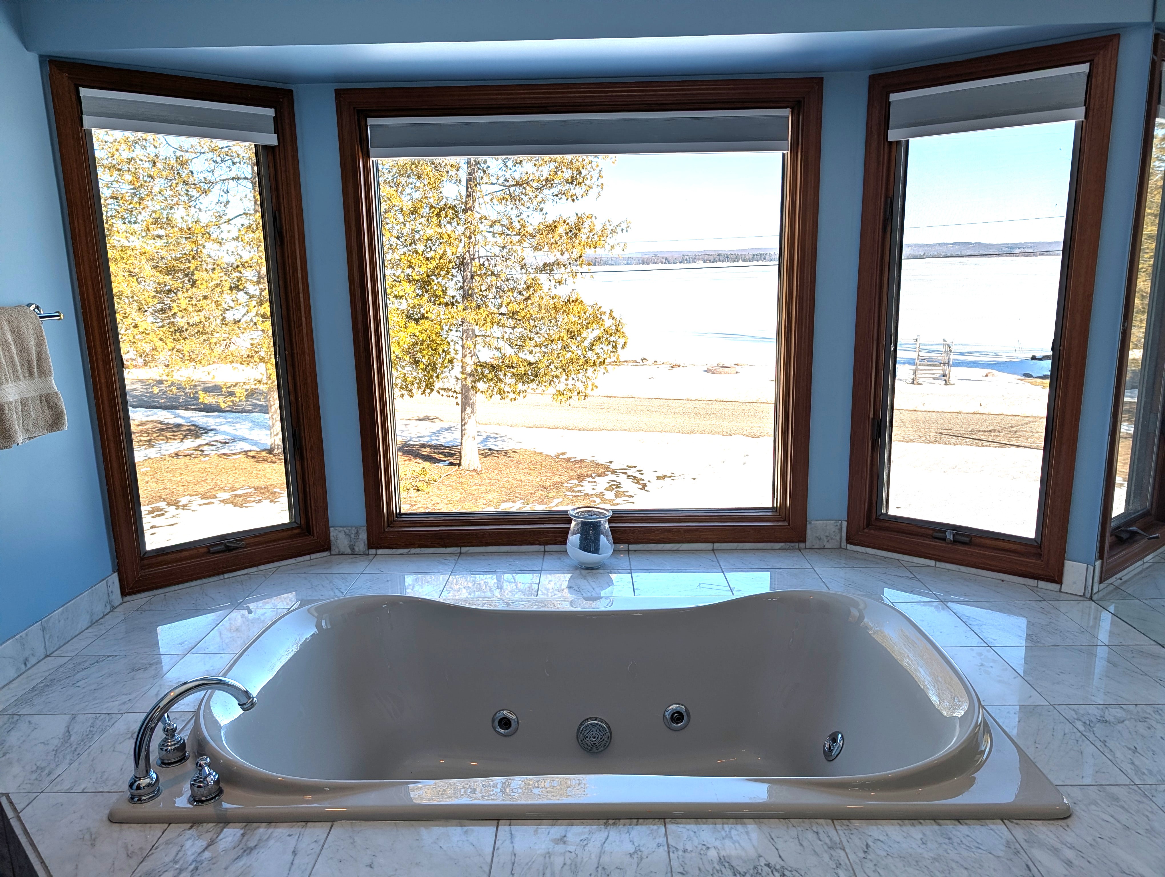 BATHROOM #2 (SECOND FLOOR):  This is a large private ensuite full bathroom for Bedroom #2.  Features a gorgeous jetted bathtub with a great view of Big Platte Lake from the bathtub!