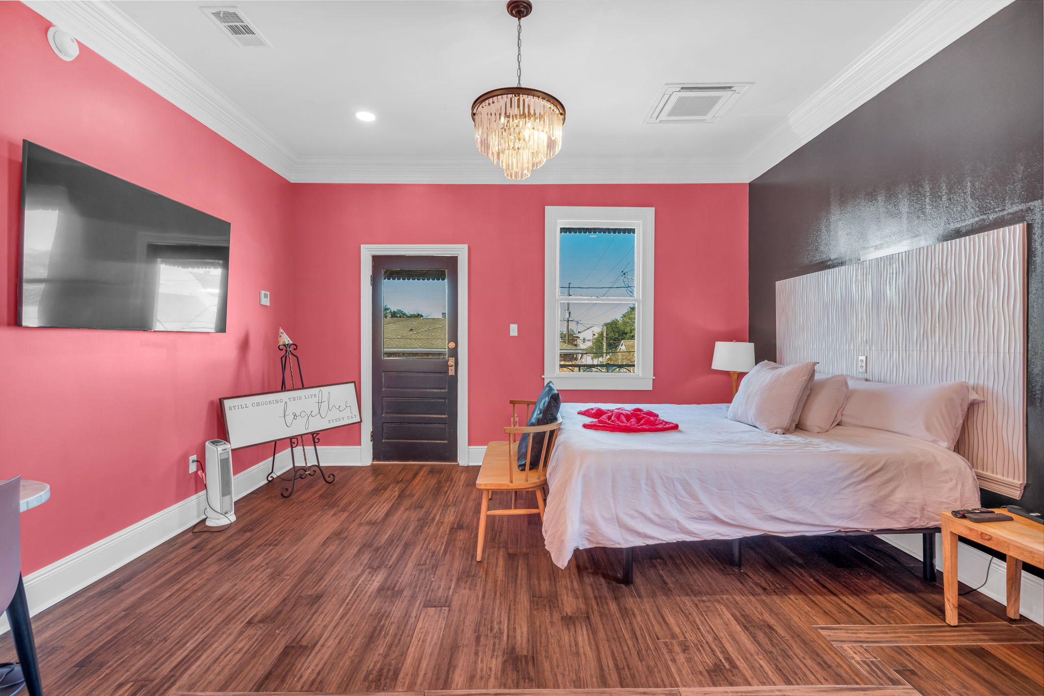 Pink bedroom filled with sunshine