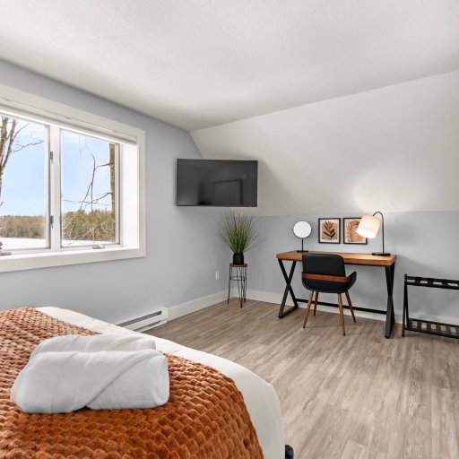 Bedroom 3 — Queen bed with dedicated workspace