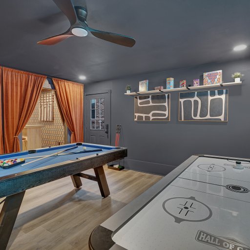 Game room with pool table, air hockey, and space to unwind.