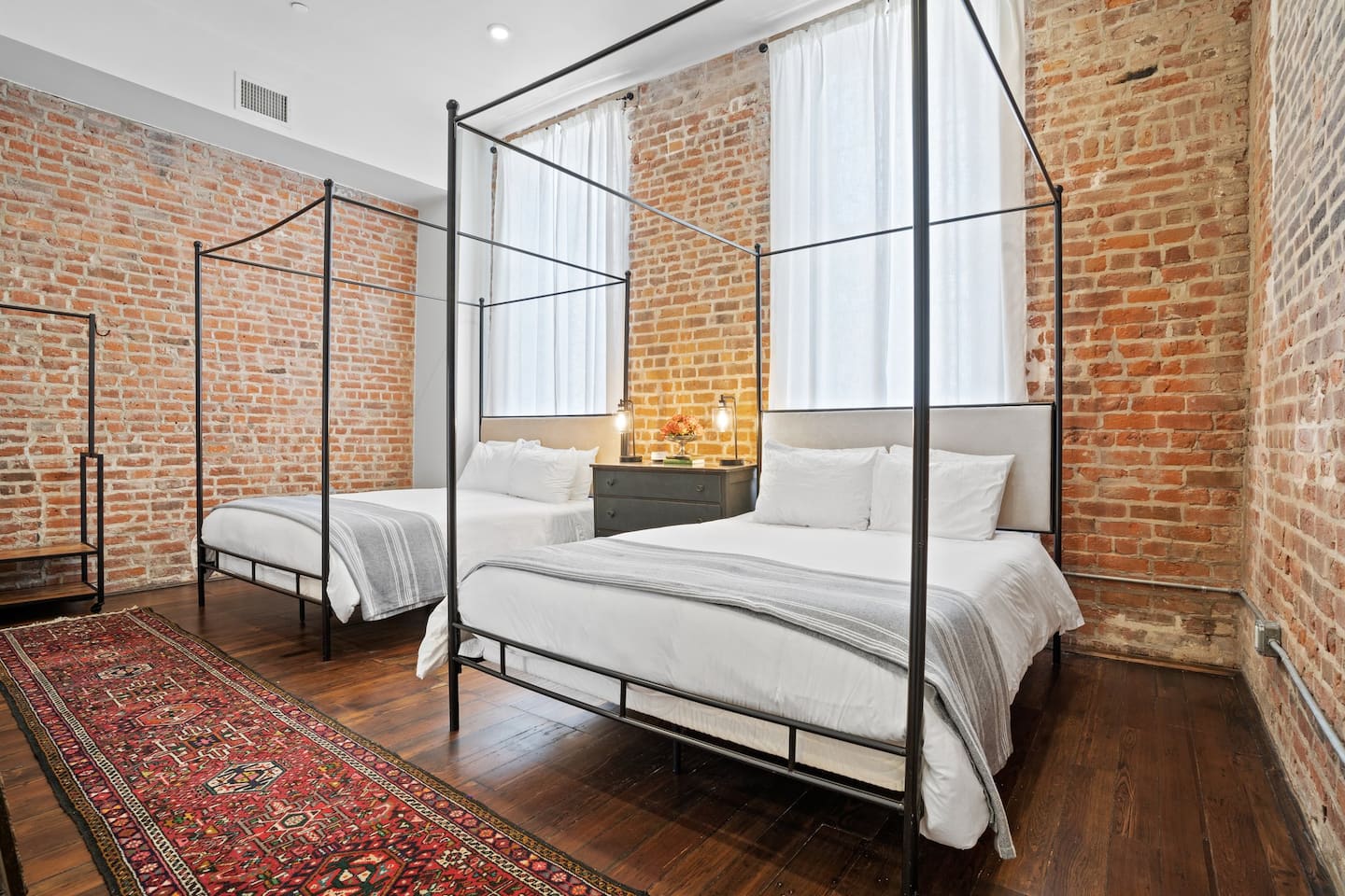 Master bedroom space with en suite bathroom | Two queen beds