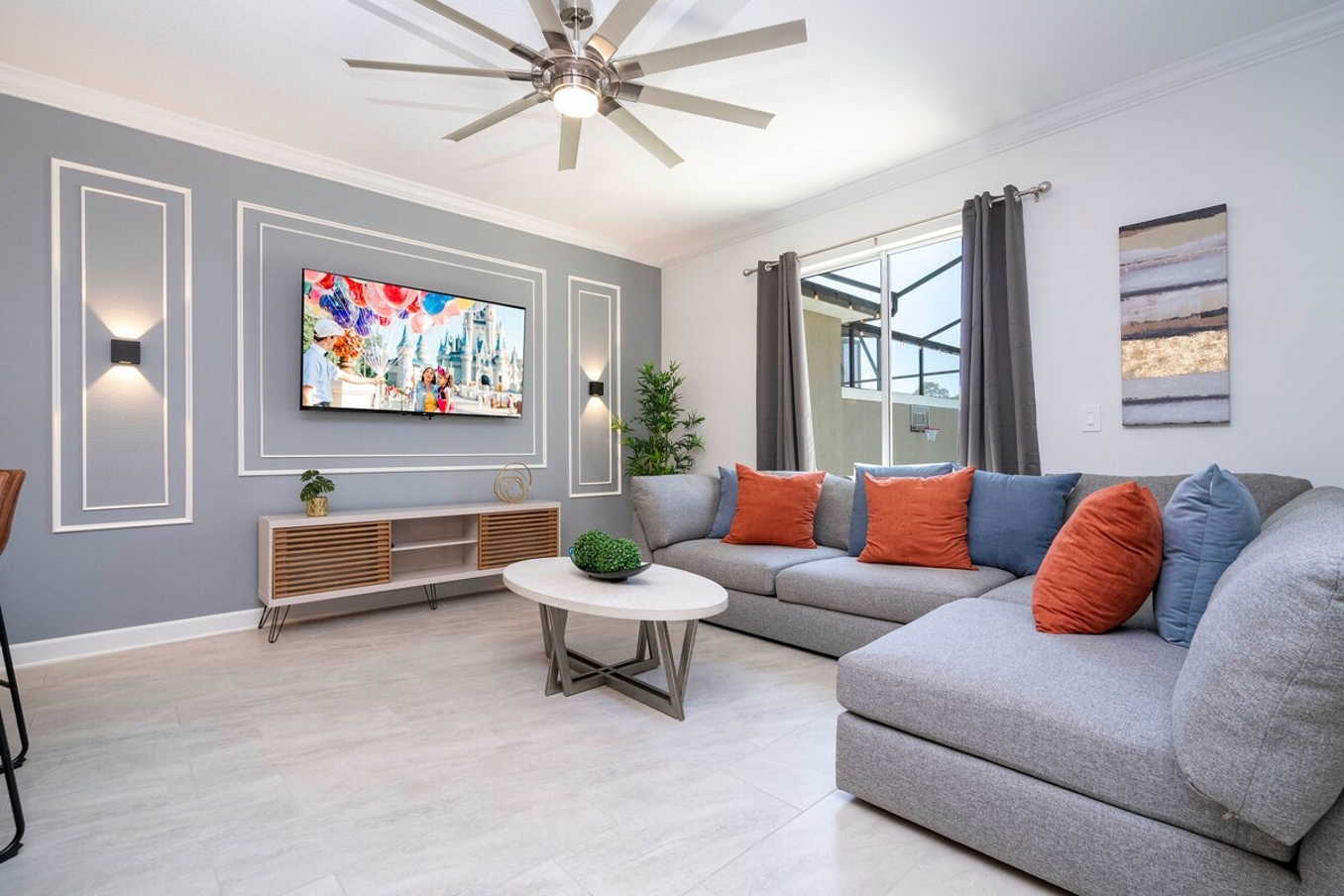 Step into this spacious, comfortable living area. The expansive room is adorned with tasteful decor, offering a blend of modern aesthetics and homey warmth. 