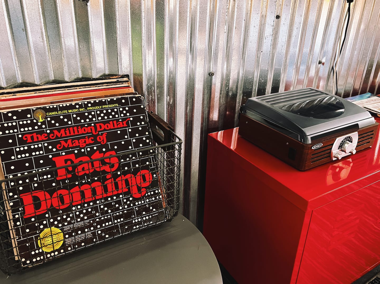 Turntable and a crate of records.