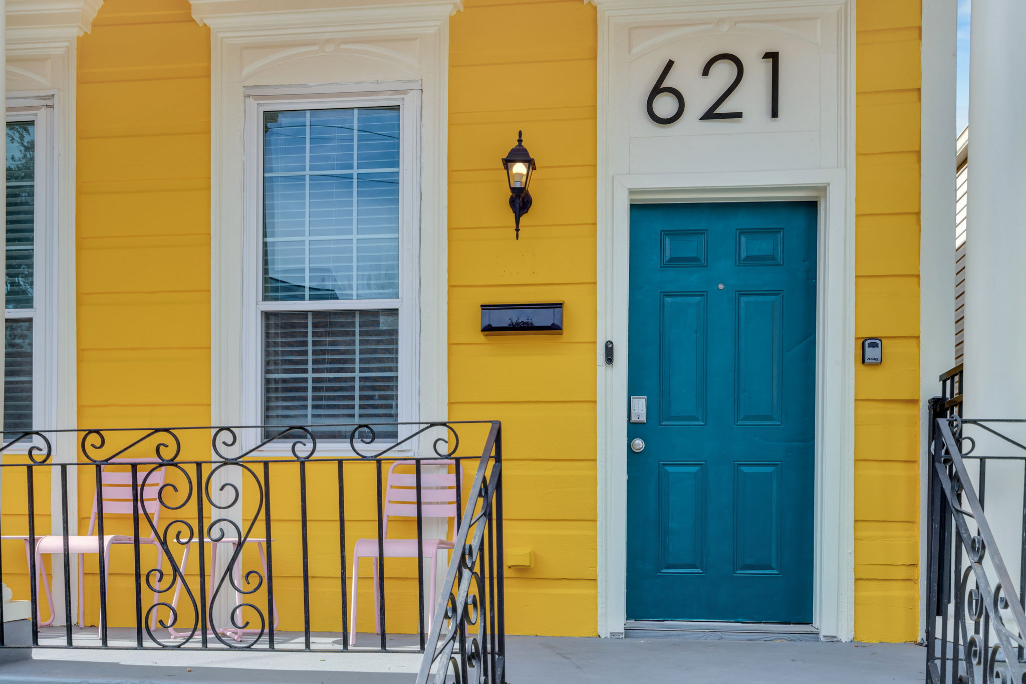 Bold teal front door—pure NOLA personality