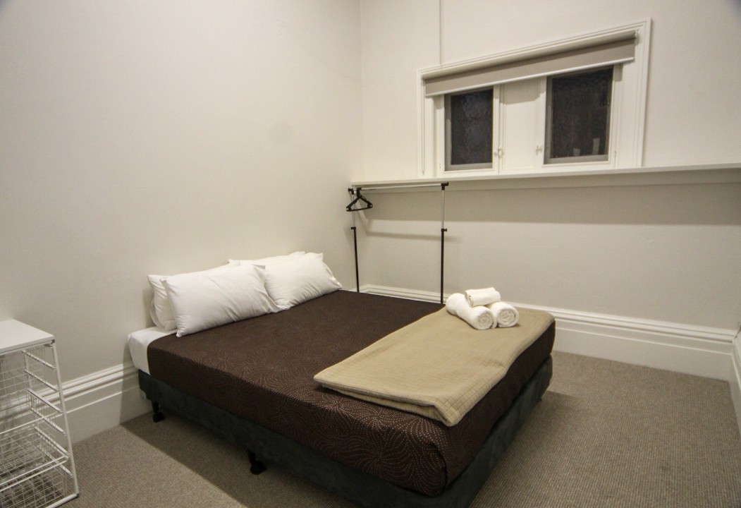 Bedding includes queen bed and two bunk beds (no beach view, no balcony for this unit).