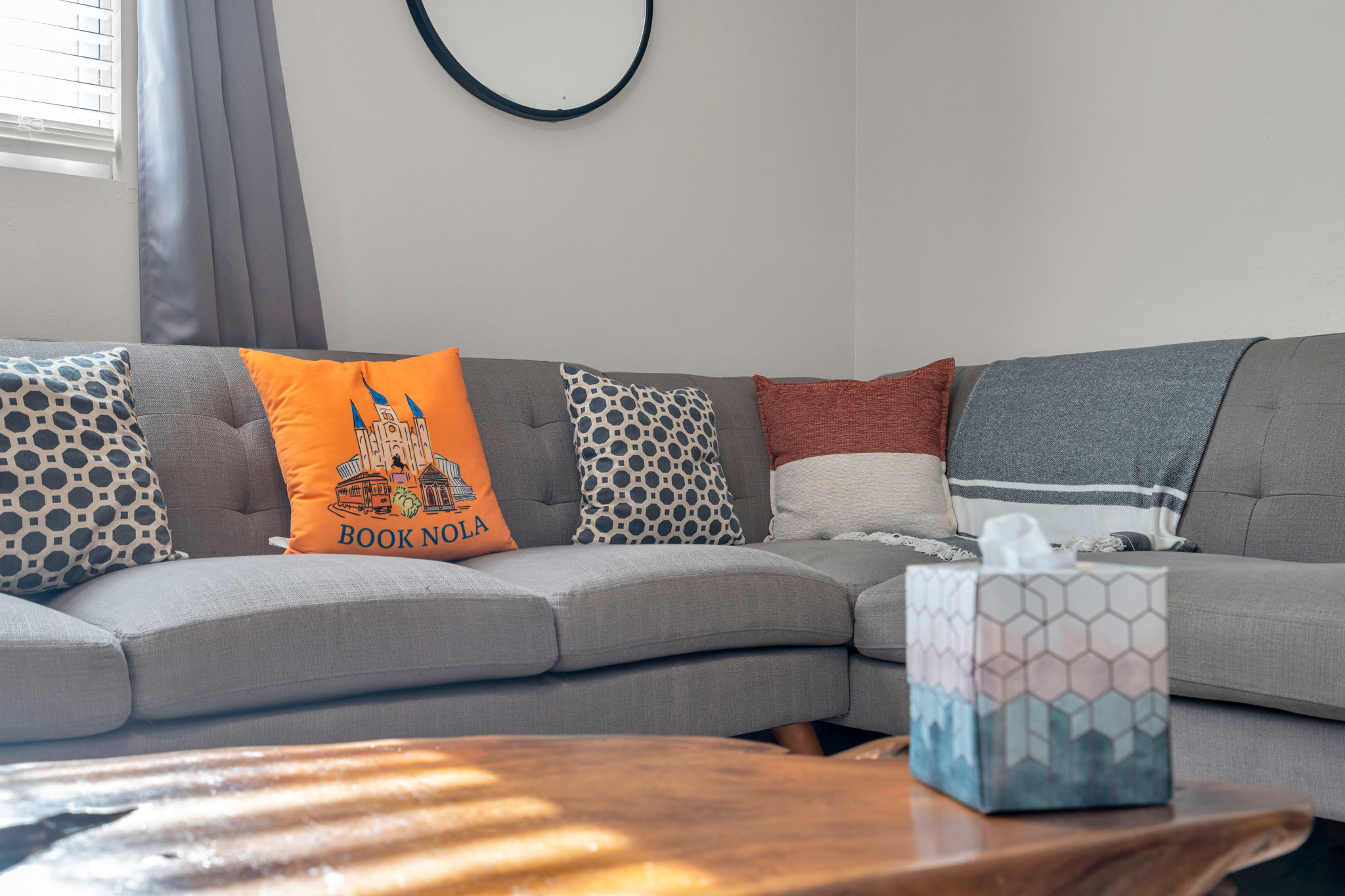 Comfortable sofa with local Book NOLA touches