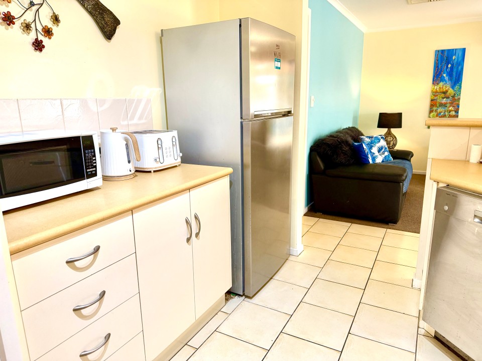 Fully Equipped Kitchen & Dining
Includes walk-in pantry, full-sized fridge, cooktop, oven, dishwasher, and generous bench space—plus indoor and outdoor dining zones.