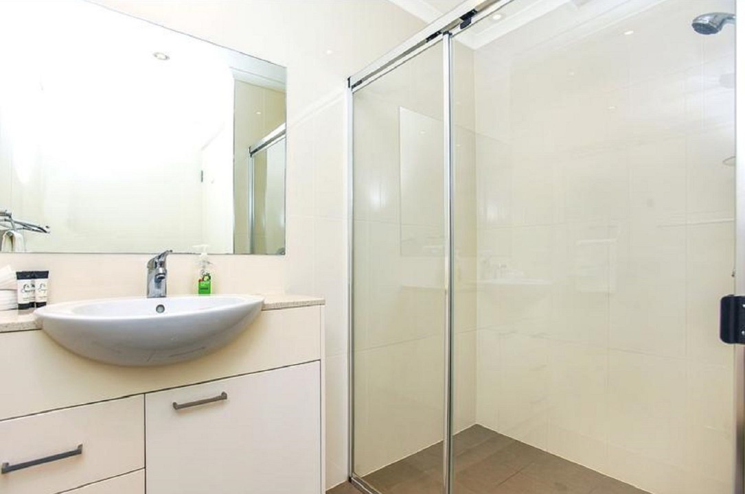 Central powder room with additional shower