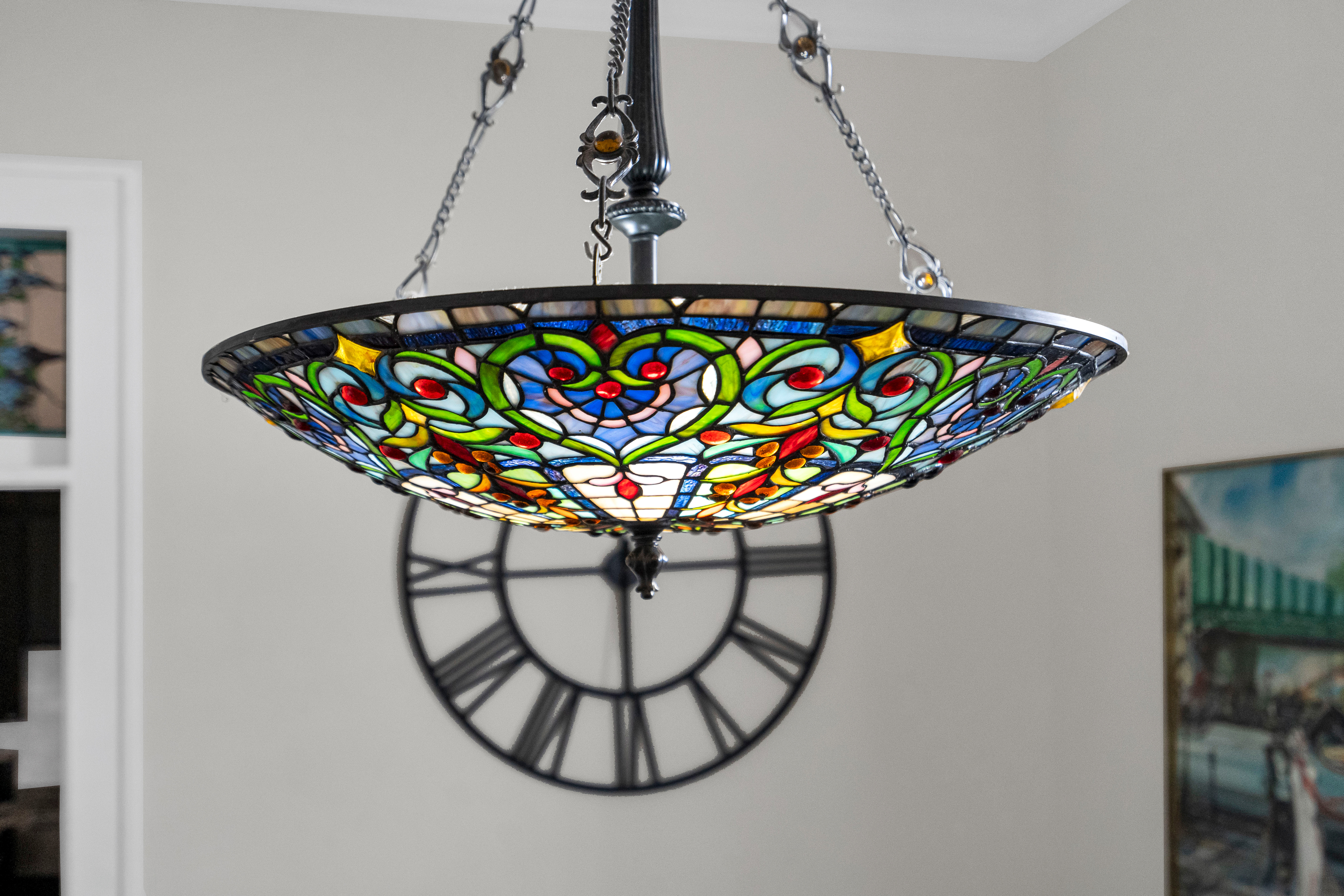 Beautiful stained-glass chandelier adding a touch of colour and style.