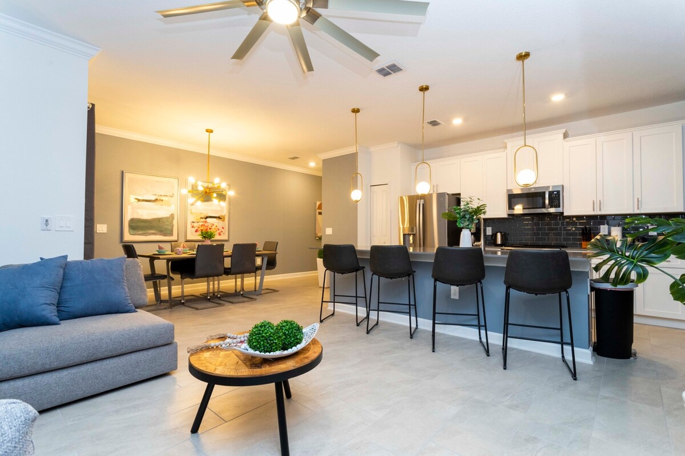 The fully equipped kitchen features modern appliances, sleek cabinetry, and all essential cookware and utensils, making it perfect for preparing meals with ease.