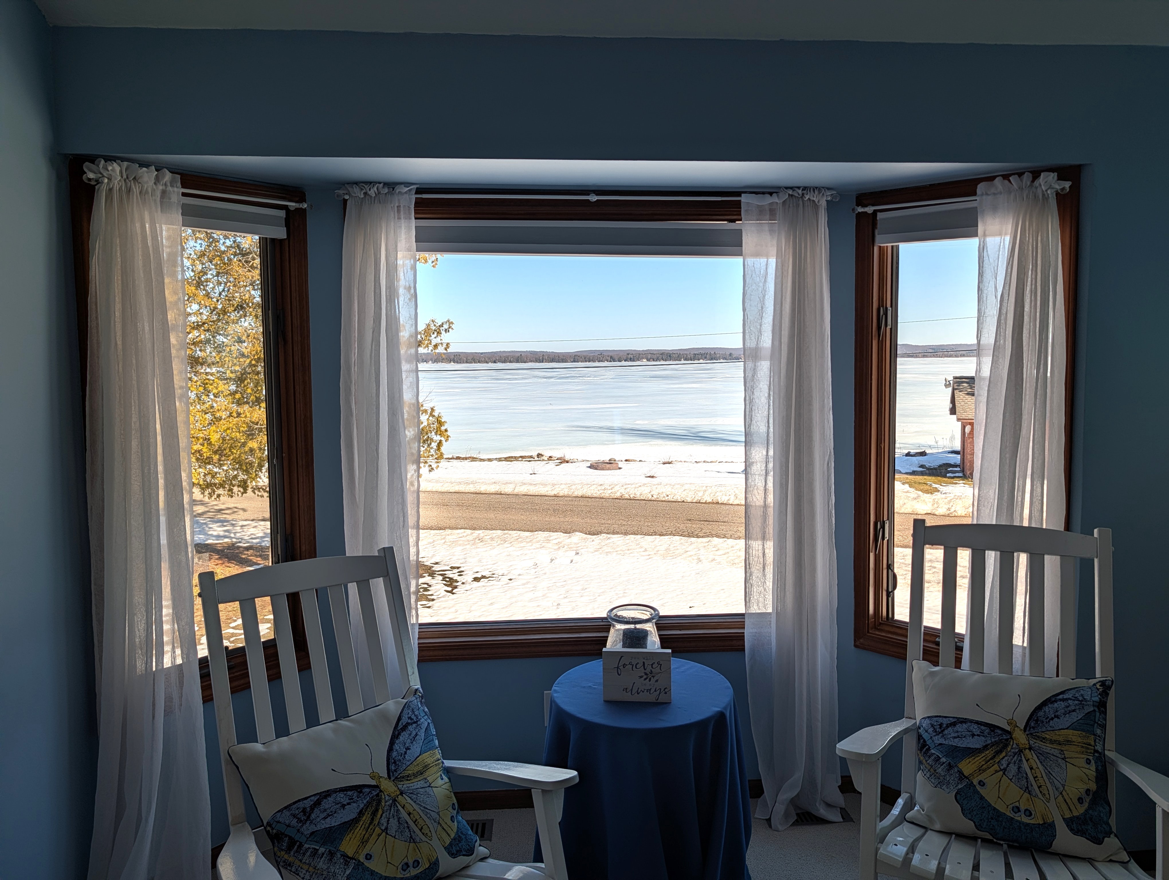 BEDROOM #2 (SECOND FLOOR):  The home has a huge primary bedroom on the second floor with a queen-size bed, private ensuite bathroom, and great views of Big Platte Lake!
