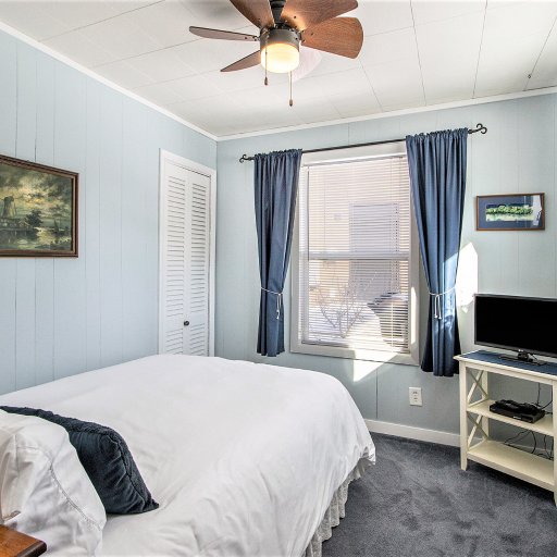 Bedroom 2 — Double bed with smart TV and closet