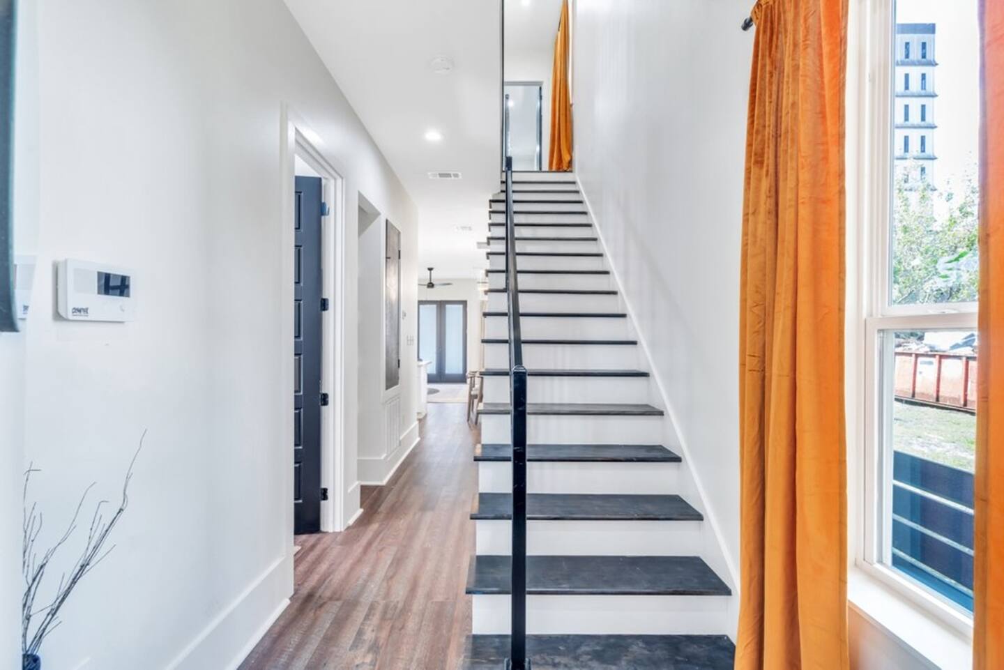 Entryway and staircase leading to bedrooms