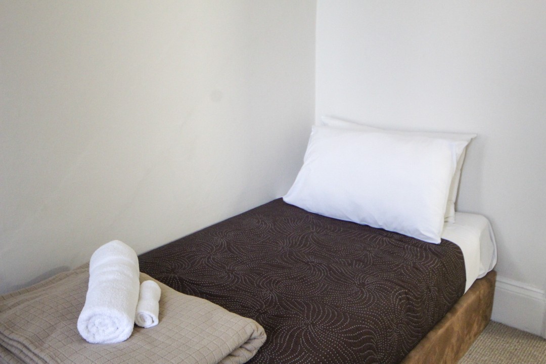 Bedding includes queen bed and two bunk beds (no beach view, no balcony for this unit).