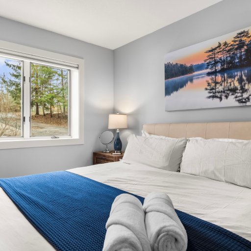 Bedroom 2 — wake up to trees and lake through the window