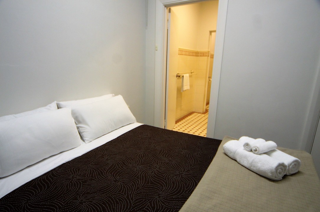 One spacious bedroom featuring a queen-sized bed, delivering comfort and privacy