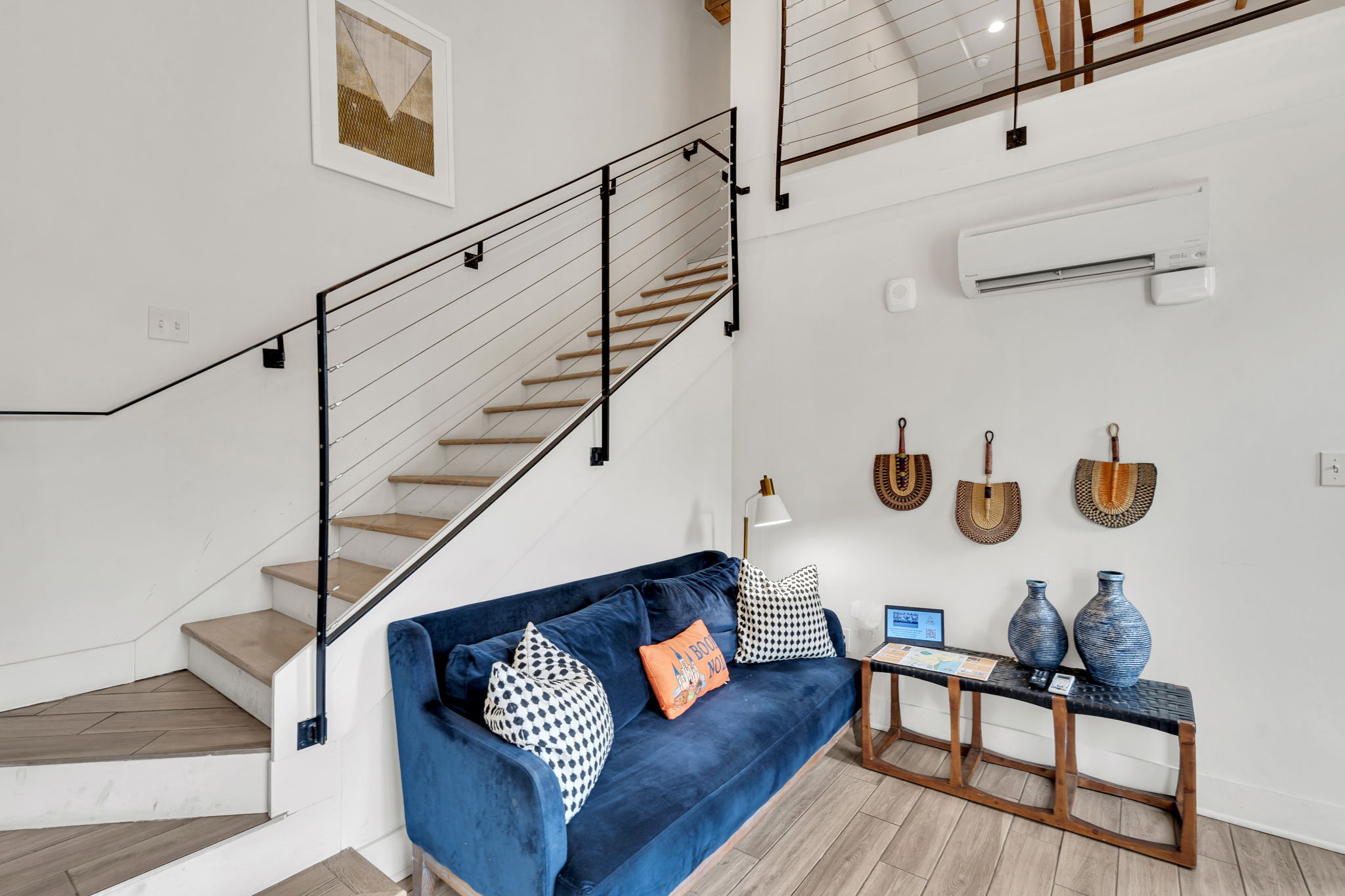Stylish open-concept loft with modern decor, cozy seating, and vibrant New Orleans charm. (unit 2)
