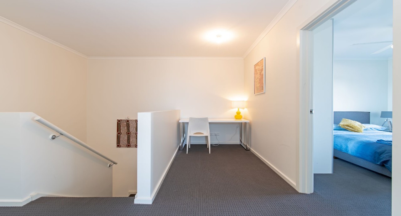North-facing courtyard and side yard with outdoor settings and intimate seating nooks for alfresco enjoyment. Main bathroom with separate bathtub and shower — ideal for families or guests needing flexibility.