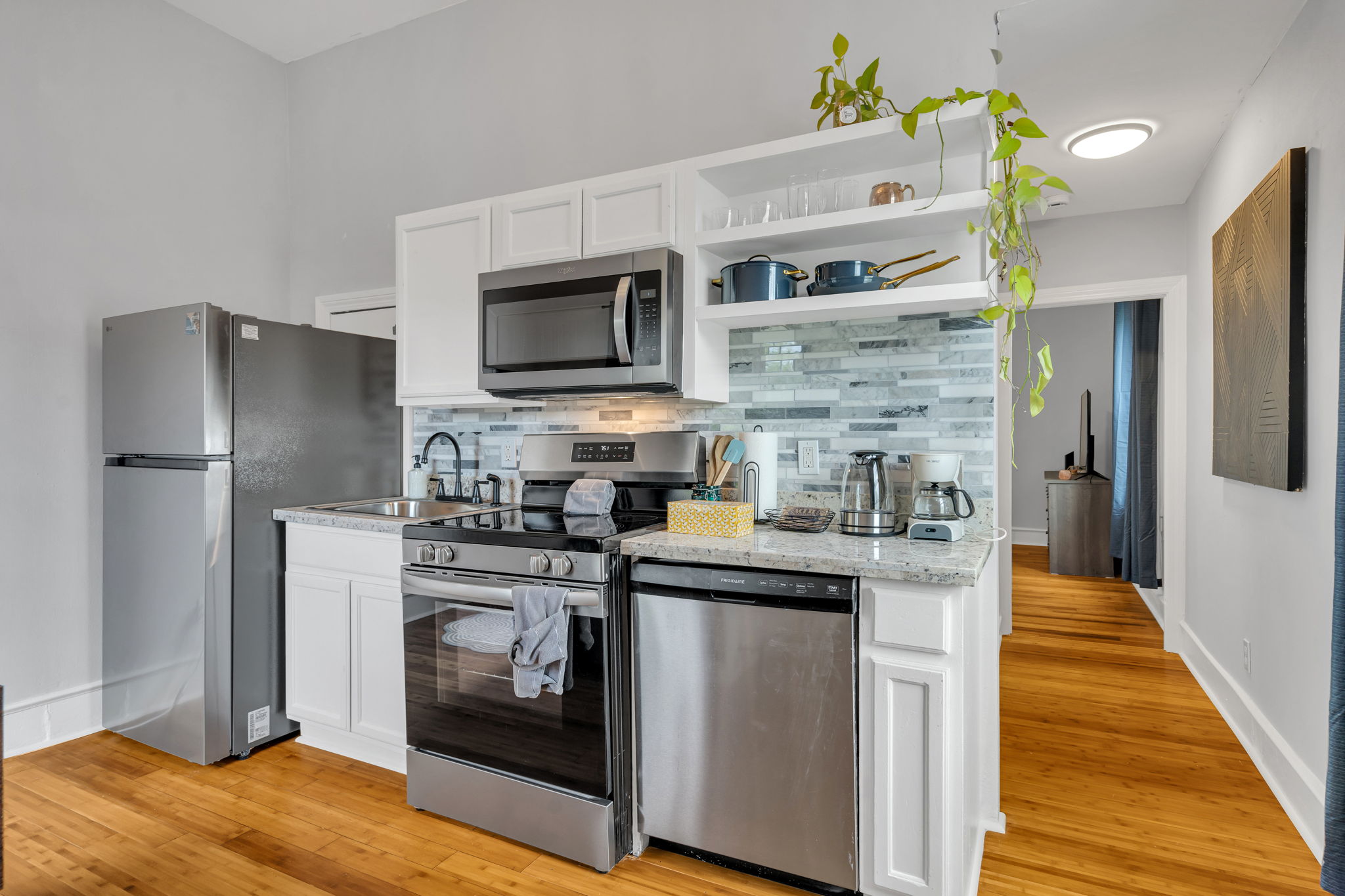 Fully equipped kitchen with stainless steel appliances and modern finishes.