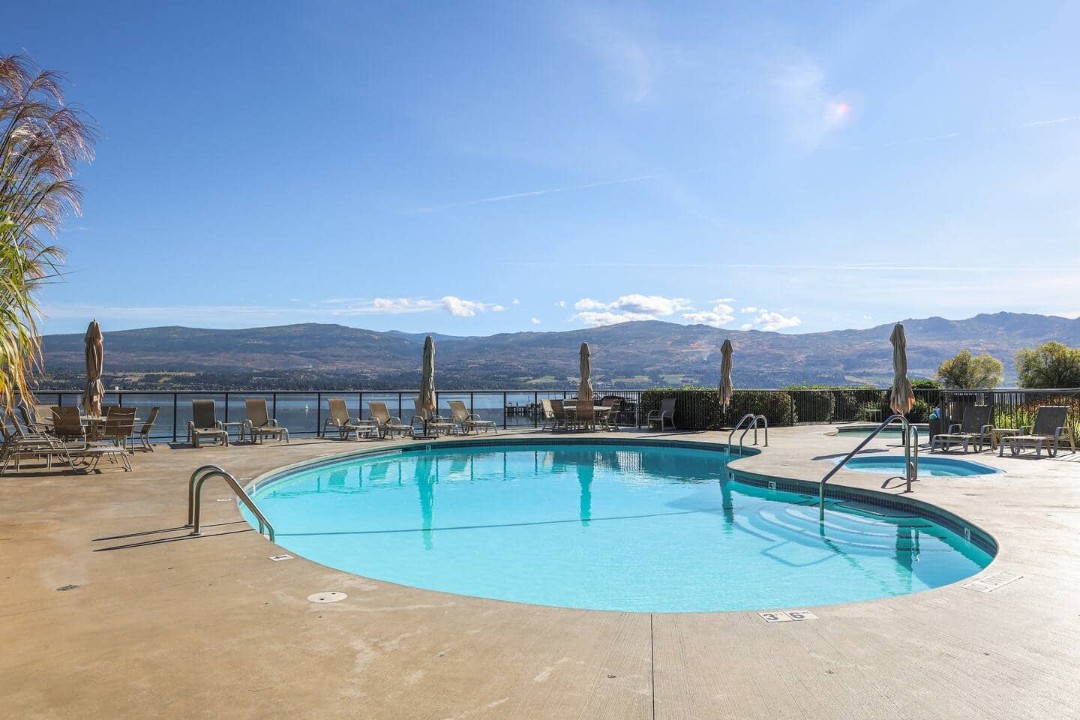 Relax by the swimming pool with stunning lake and mountain views ...