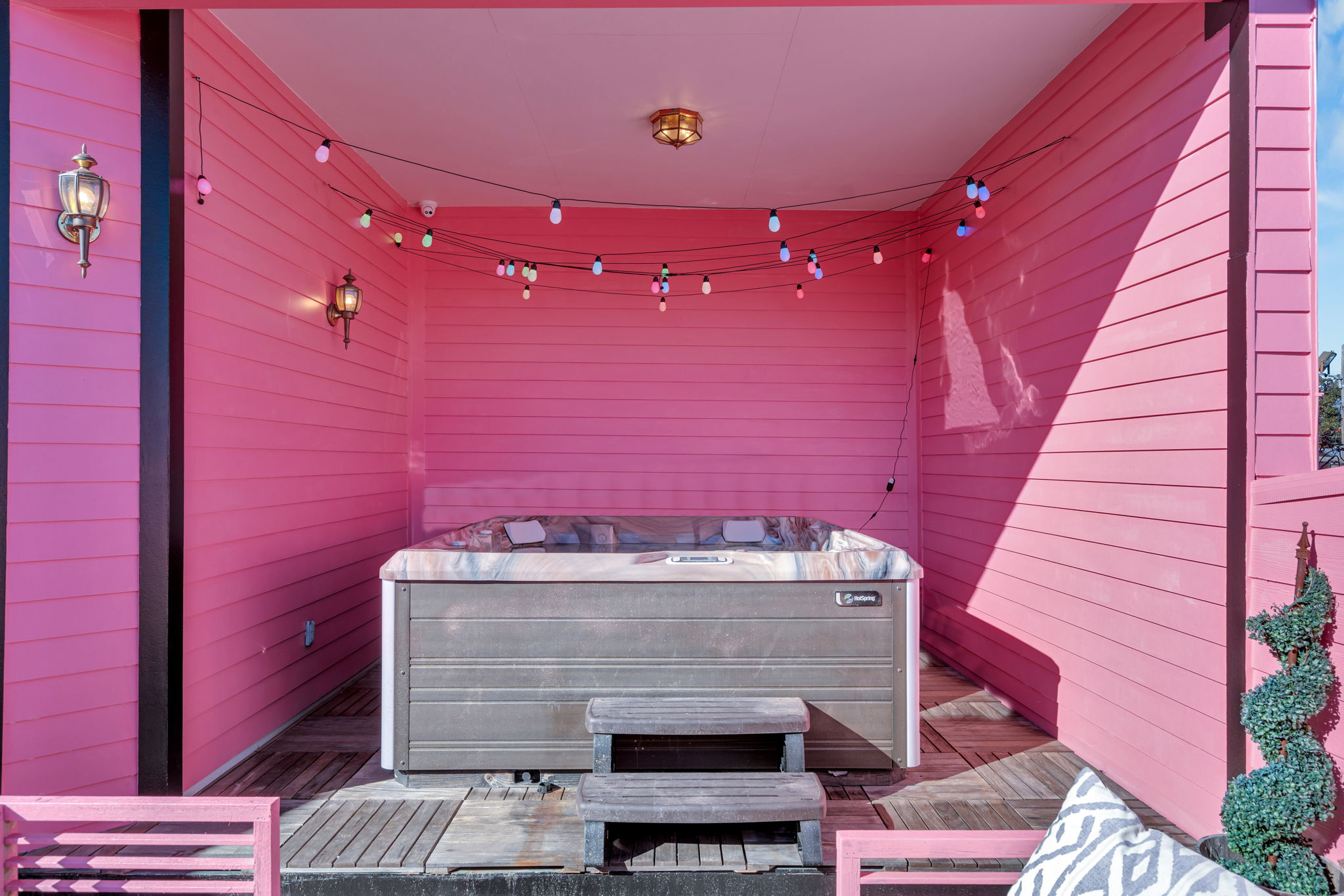 Soak under café lights in the hot tub