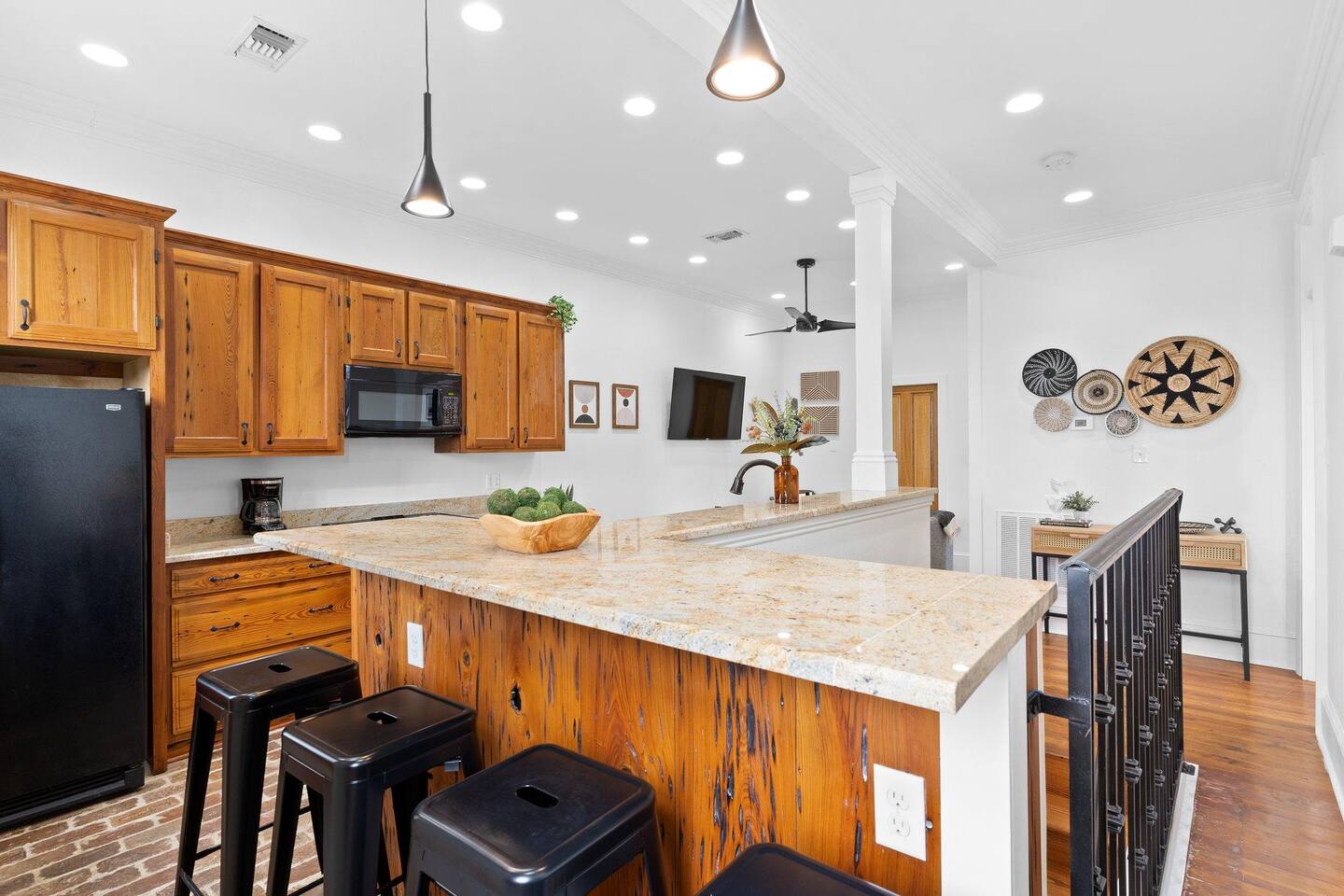 View of the kitchen/living room from the bar area.