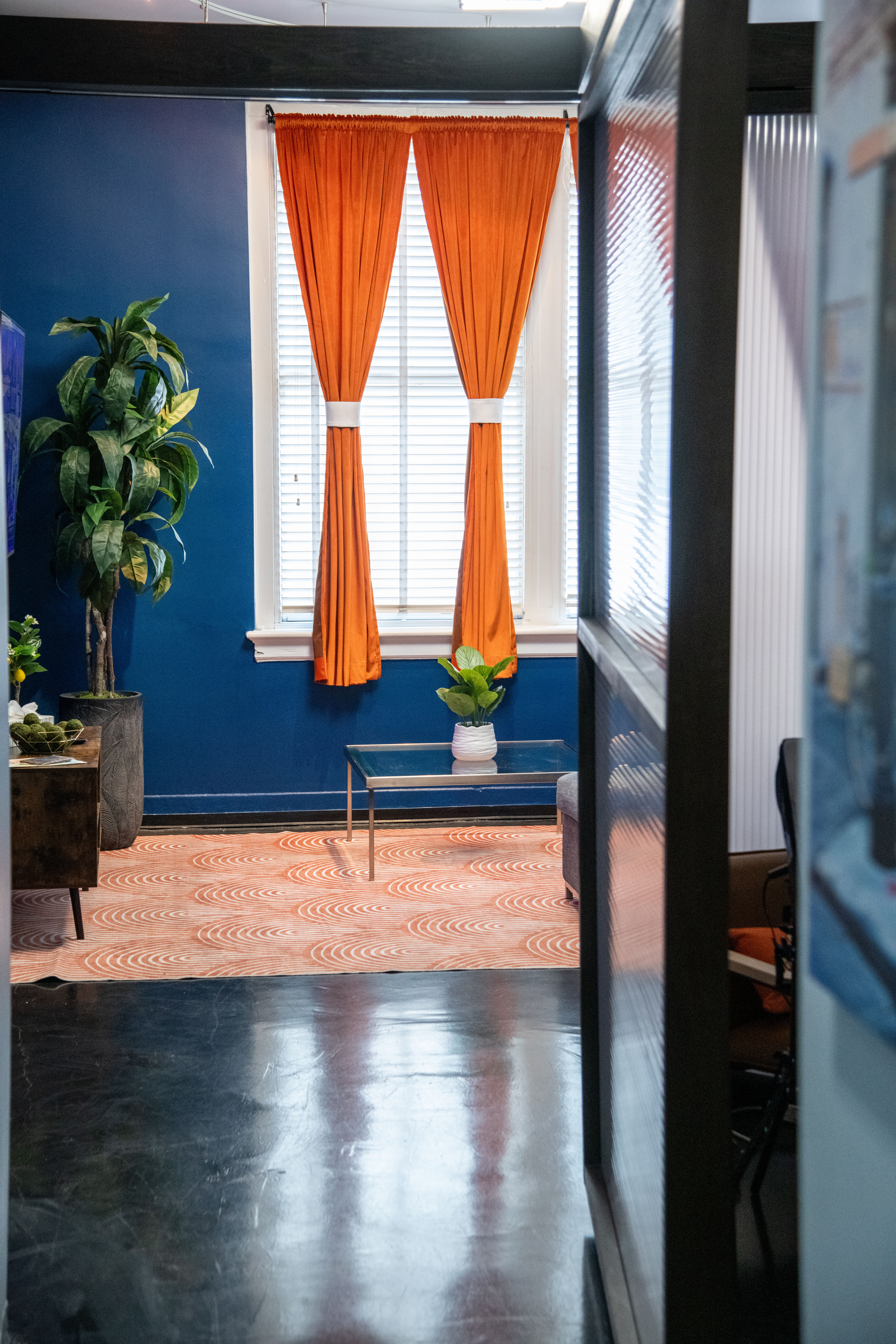 Bold colors and natural light fill the space.