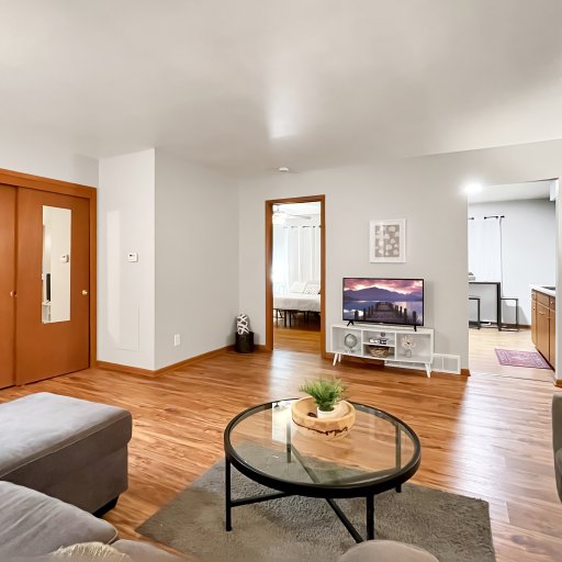 Living Room with smart TV, with entrances to Master bed and kitchen
