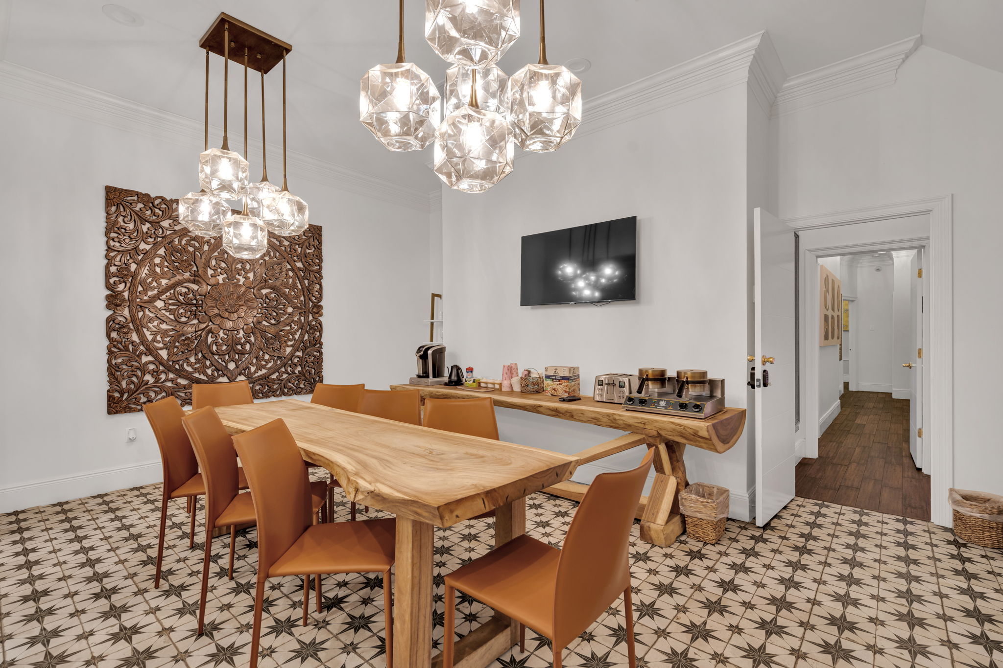 Warm dining space with designer lighting