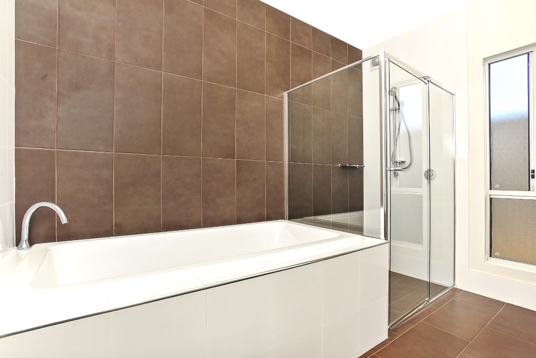 Each bathroom is designed for easy access and functionality, supporting large group stays. 