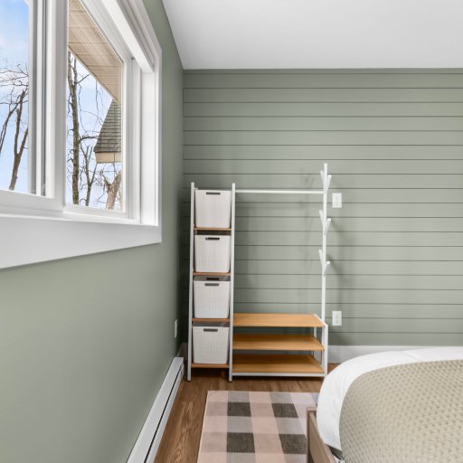 Bedroom 1 — shiplap accent wall with natural light