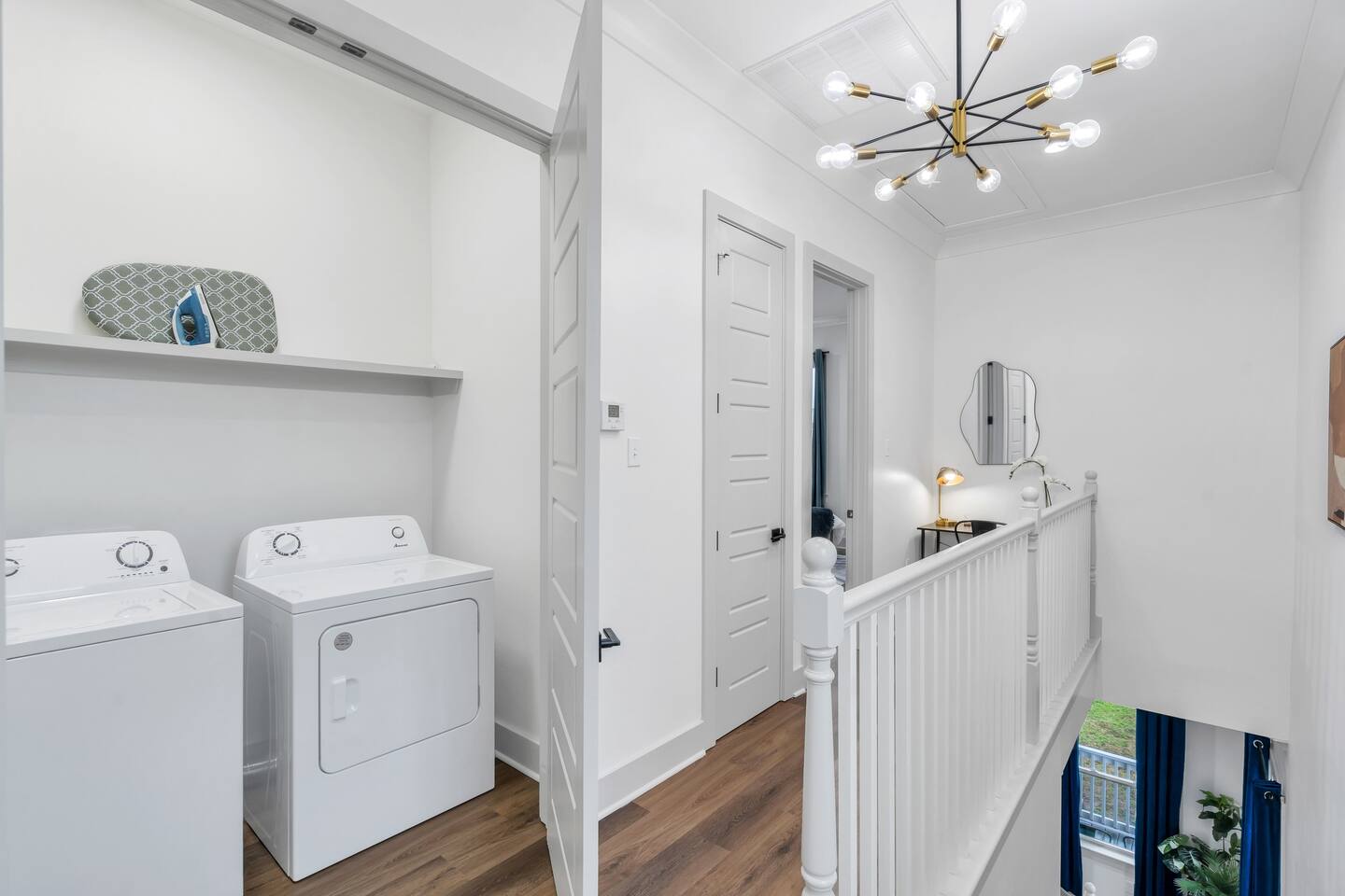View into the laundry room from the top of the stairs