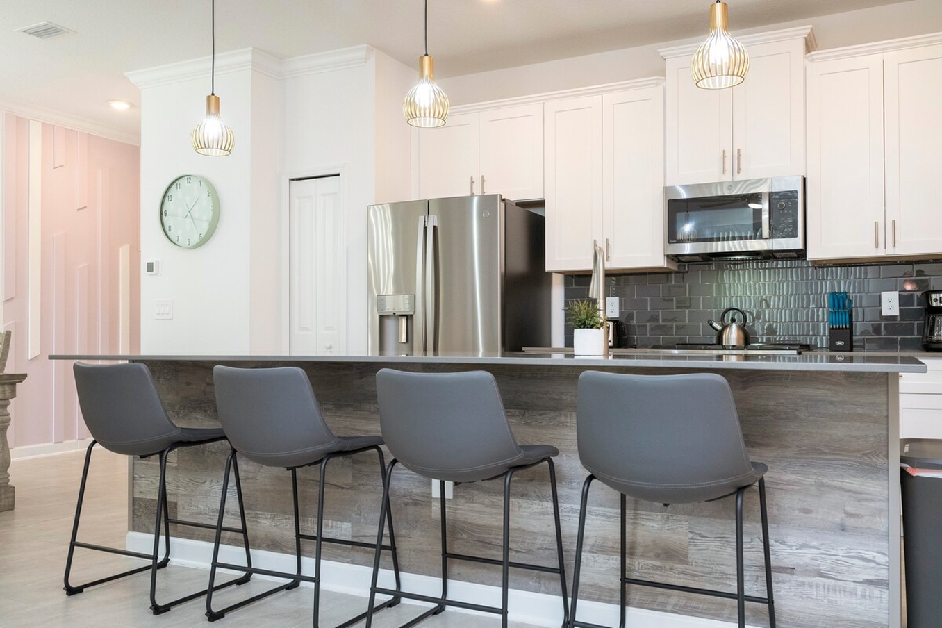 The fully equipped kitchen features modern appliances, sleek cabinetry, and all essential cookware and utensils, making it perfect for preparing meals with ease.