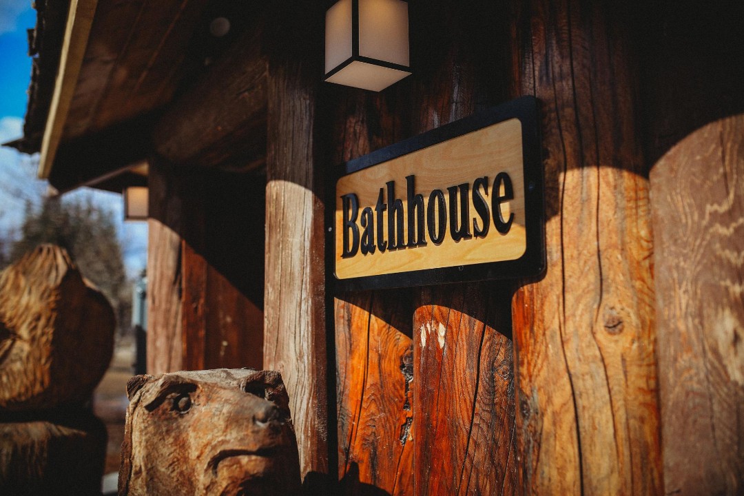 Enjoy access to a rustic shared bathhouse featuring two bathrooms ...