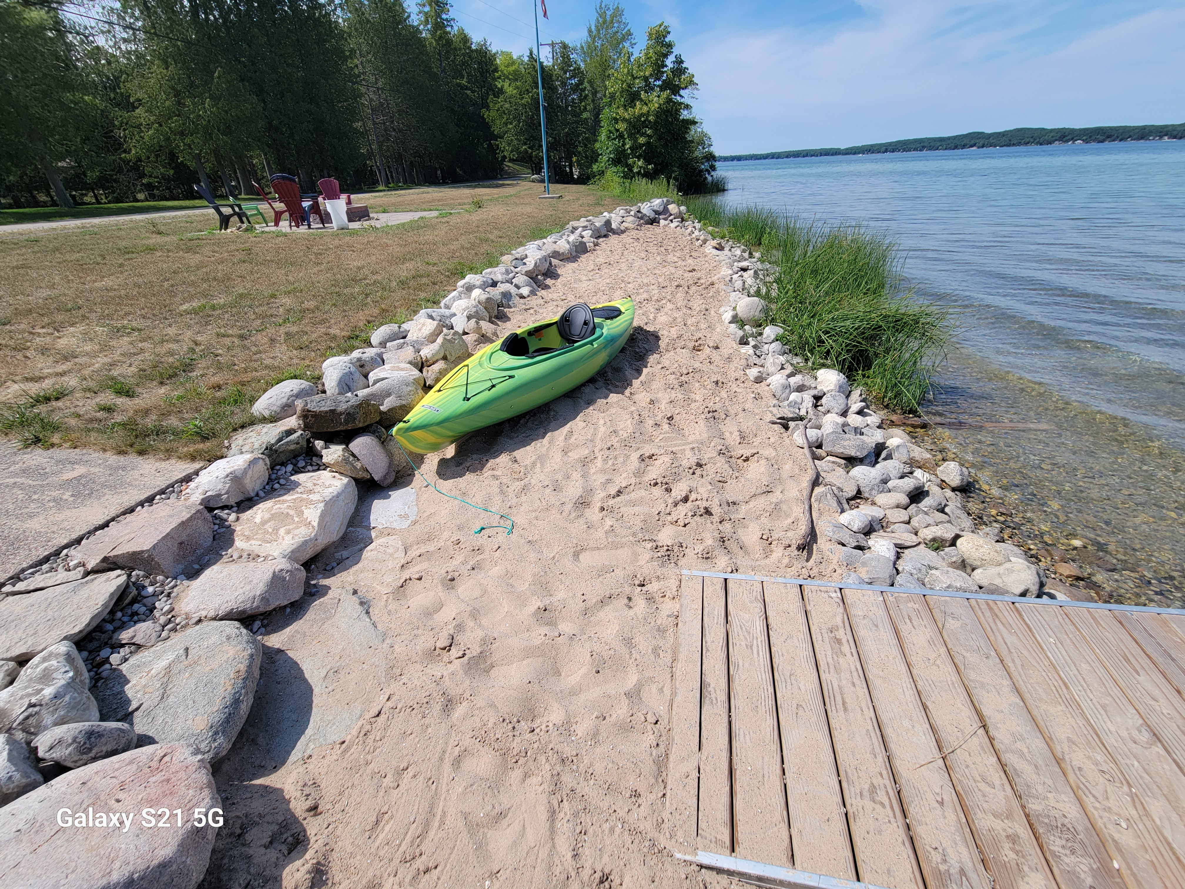 OVERVIEW:  The home also includes a private sandy beach and a private bonfire ring.  (The kayak in the photo is not included with the rental.)