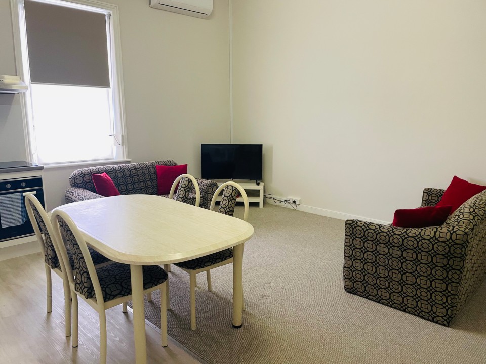 This self-contained, 1-bedroom unit is located at the rear of the building—ideal for guests seeking quiet, private accommodation with full amenities.