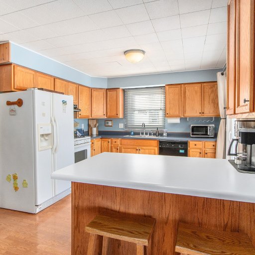 Full kitchen with gas range, dishwasher, and coffee bar