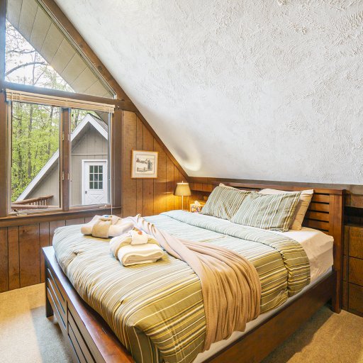 Charming bedroom with a double bed and unique architectural details—great for couples or solo travelers