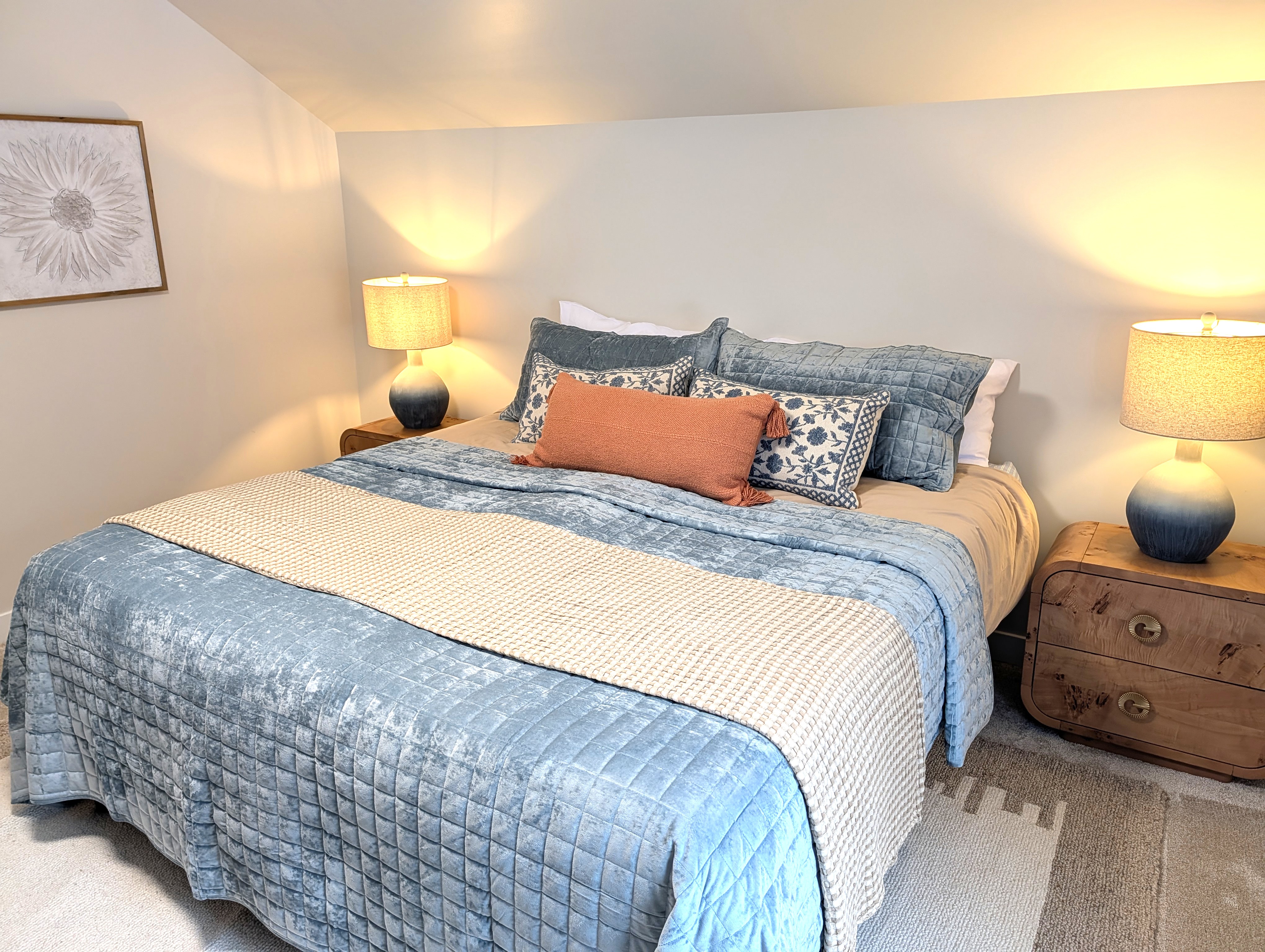 BEDROOM #2 (SECOND FLOOR):  Beautiful newly-decorated second floor bedroom with a king-size bed, private television, nightstands, lamps, dresser, and closet.